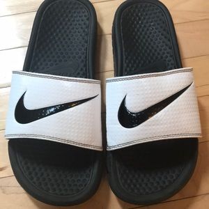 Black and white Nike slides
